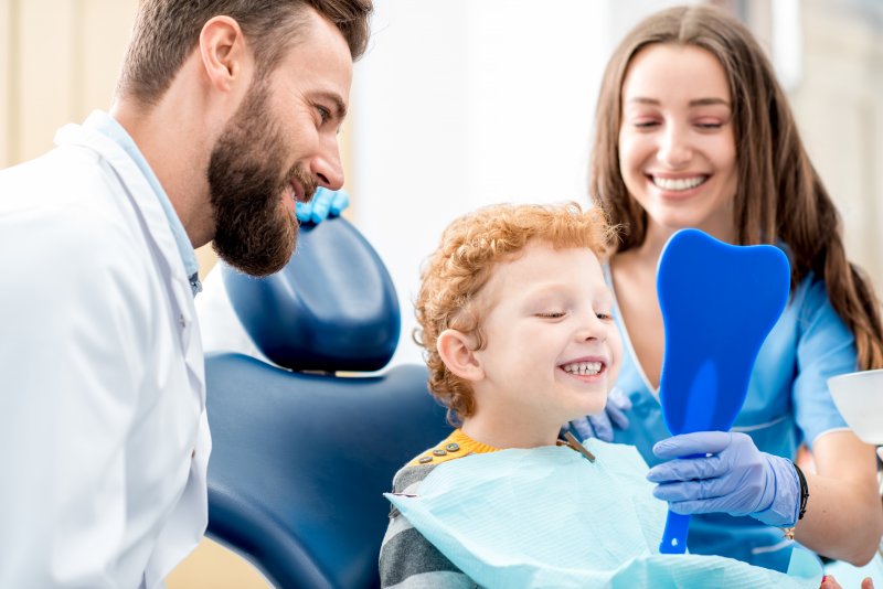 child talking to a dentist